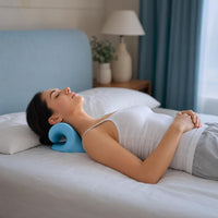 Woman using NeckCurve lying down to relieve neck tension